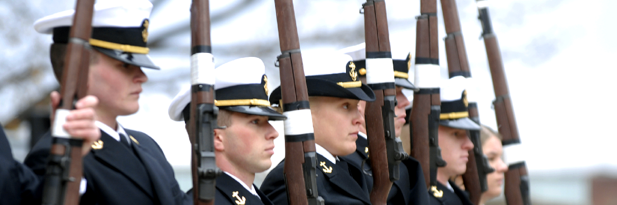 Veterans dressed in full uniform for a gun salute